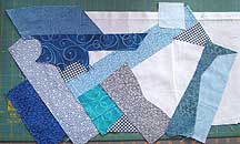 arranging scraps on foundation for collage