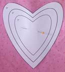 Cutting a heart-shaped fabric yo-yo