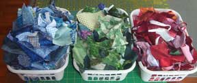 baskets with small scraps of fabric organized by color